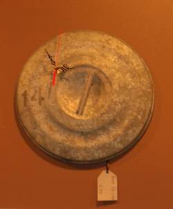 Wall clock made from a dustbin lid