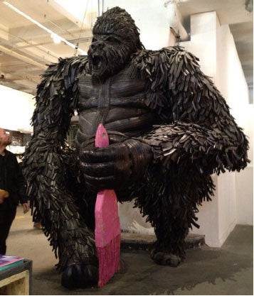 Gorilla made from tyres with pink paint brush at LDW