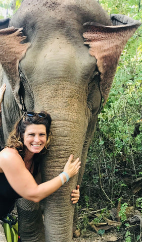 Julia hugs an Elephant in Laos