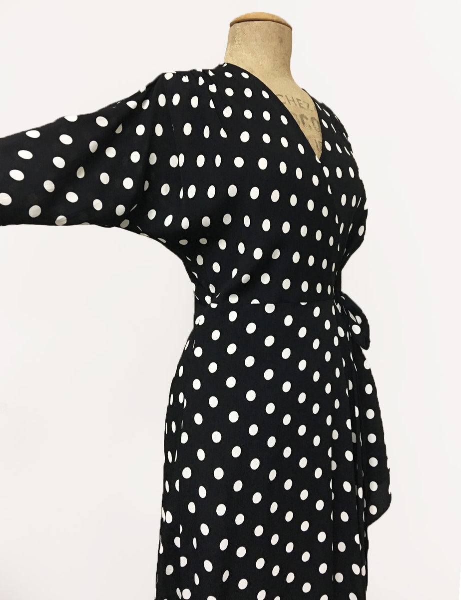 white wrap dress with black polka dots