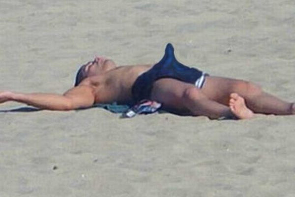 Man on beach with an erection