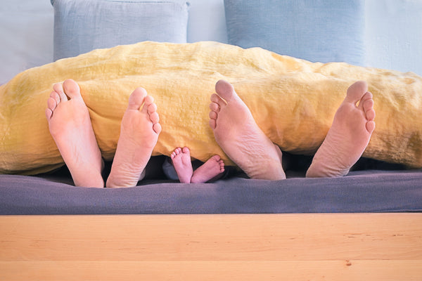 Mother, Father And Baby Feet