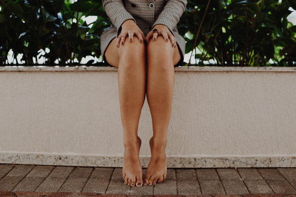 Lady with bare hair free smooth legs