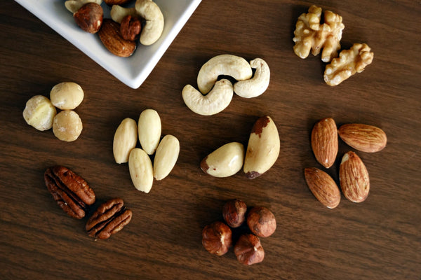 A selection of nuts on a wooden table