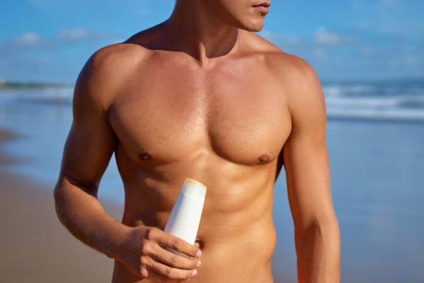 Body of a hot man on the beach 