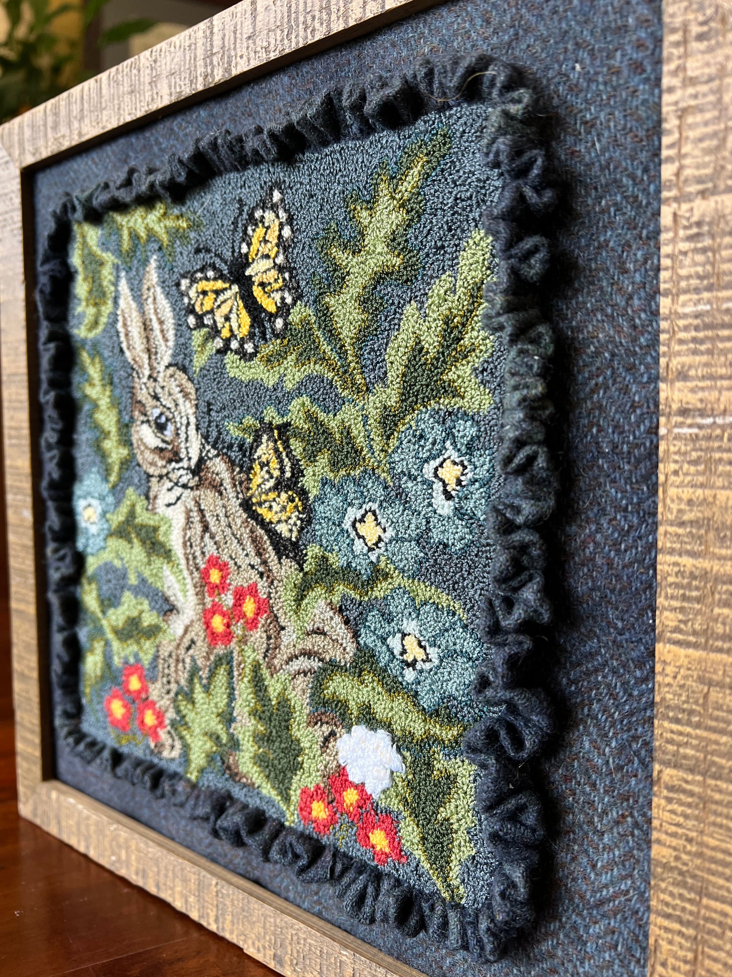 Hare with Friends PDF Digital Download Punch Needle Pattern by Orphaned Wool. This design is for anyone that loves bunnies and butterflies. This bunny is nestled in with flowers and foliage. makes a stunning finished design. DMC Floss was used in pattern.
