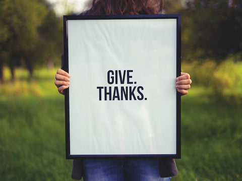 Woman holding picture frame - Give thanks