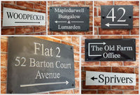 Montage of directional house signs with pointing arrows