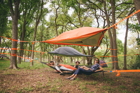 3 friends hanging out in a Trillium hammock with Stingray Tree Tent above