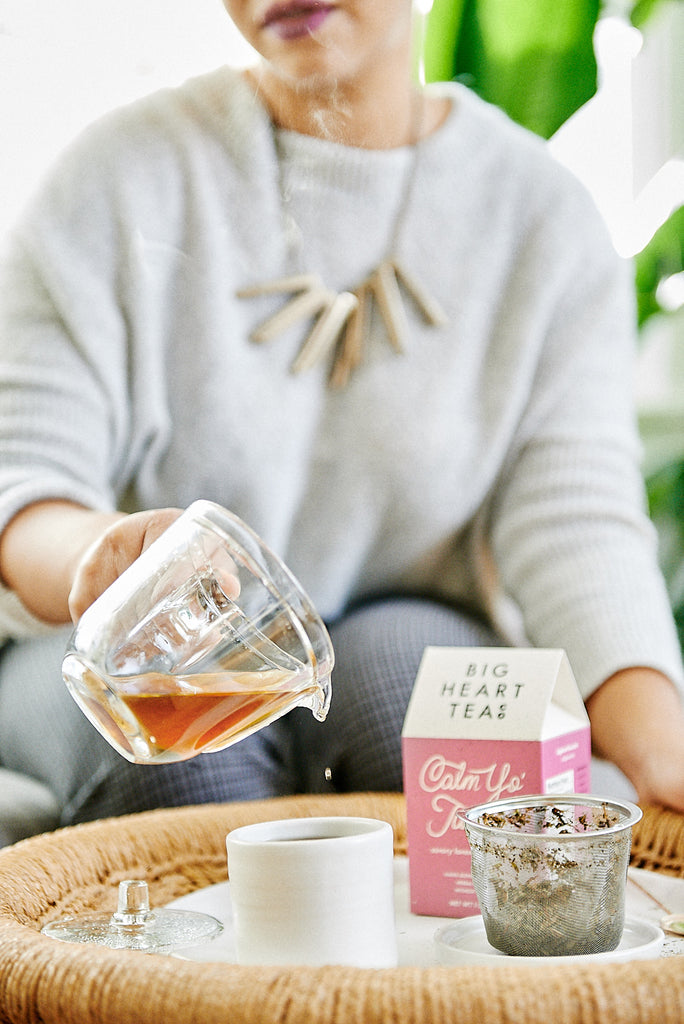 Pouring a fresh cup of Big Heart Tea Co.'s Calm Yo Tummy, an organic loose leaf tea (model: LaCrossia Wilderness of Butterlove LLC)
