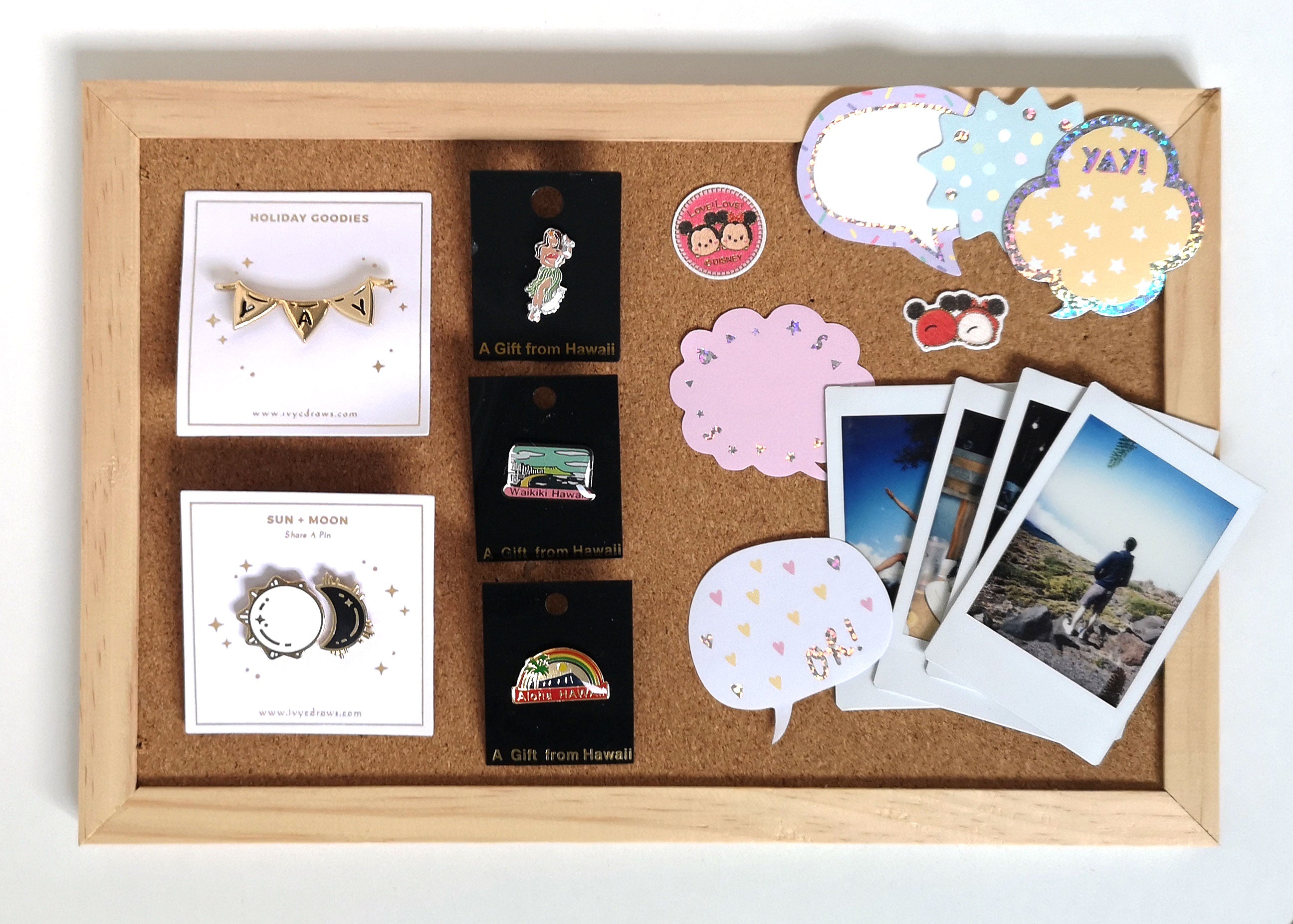 enamel pins, stickers, souvenirs, and polaroids