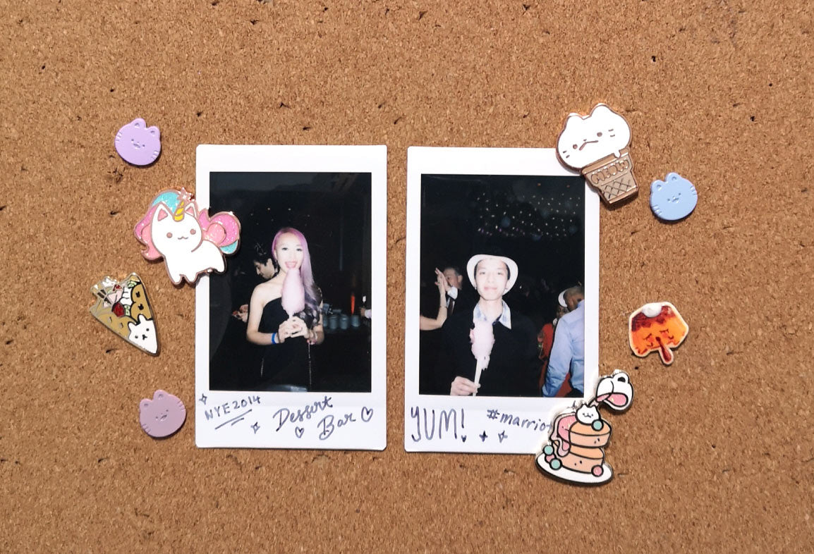 Polaroid pictures decorated with enamel pins