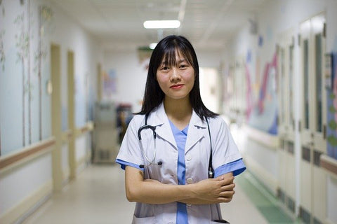 medical profession standing in hospital hallway