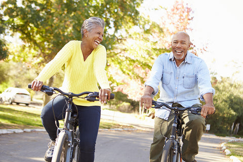 Couple riding bikes together