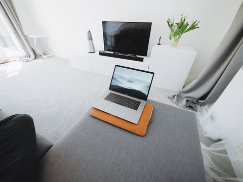 Laptop and television in room