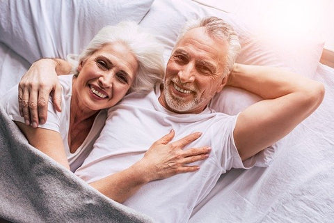 senior couple resting in bed