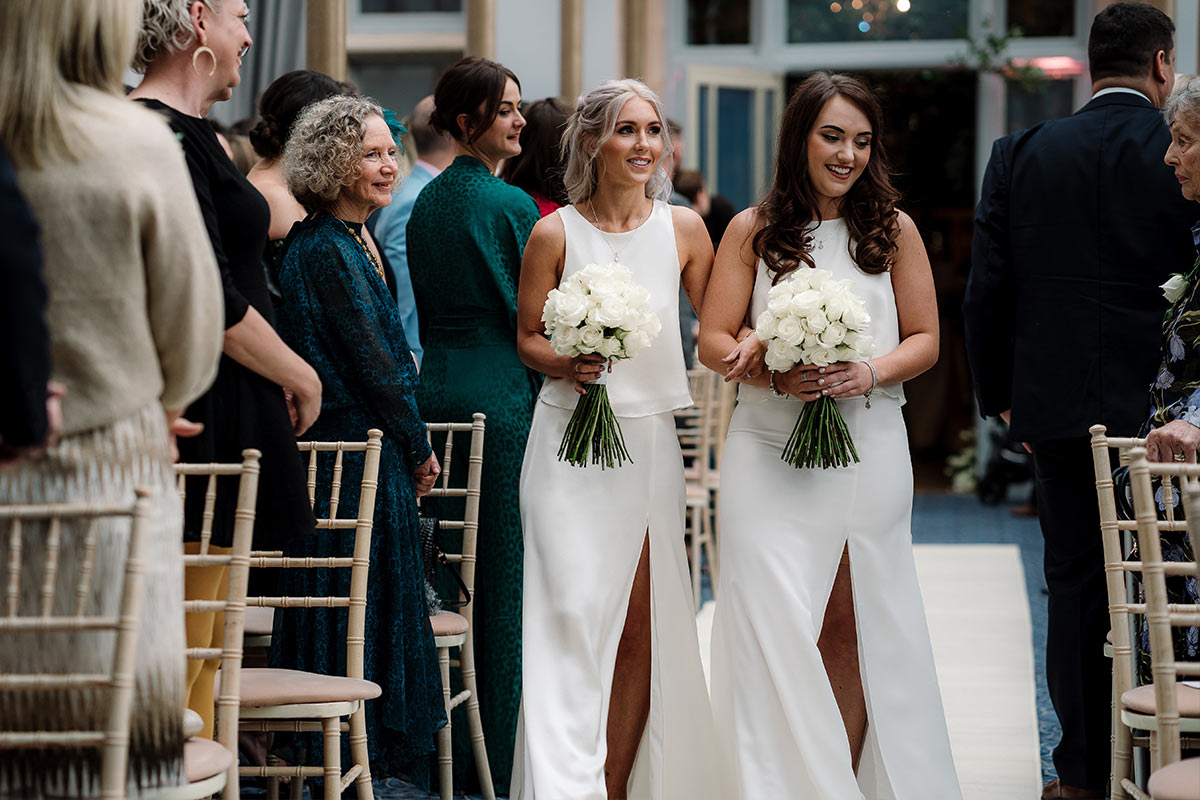 Ivory bridesmaid 2-piece skirt and top sets. On the left is our Lena silk set and our Rosie crepe skirt and top set - both are available in a range of different colours.