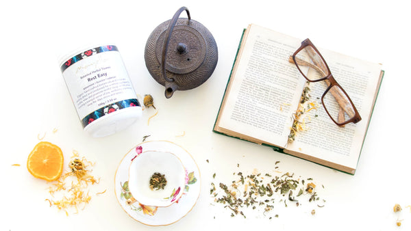 birds eye view of a teacup kettle book and Mayella rest easy tea