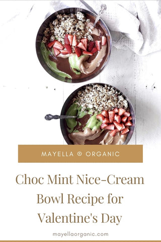birds eye view of two choc mint smoothie bowls topped with strawberries and granola