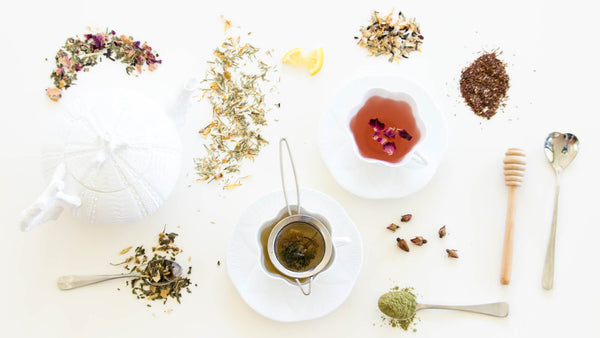 bird eye view of tea in teacup surrounded my loose herbal tea leaves