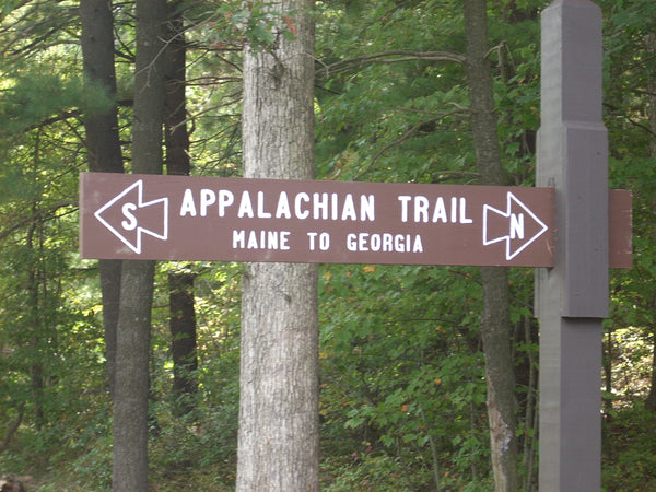 Wooden sign on the Appalachian Trail the says Maine to Georgia  