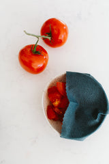 Keep cut tomatoes fresher longer by cover your bowl of tomatoes with a Goldilocks beeswax wrap