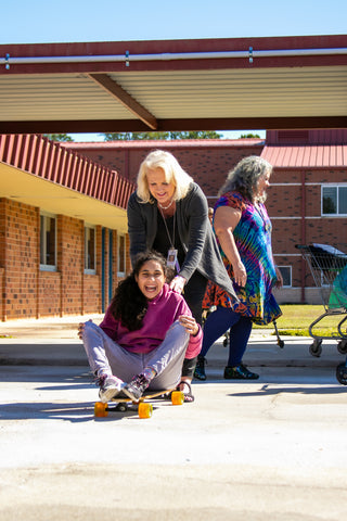 Girl Being Pushed on Skateboard