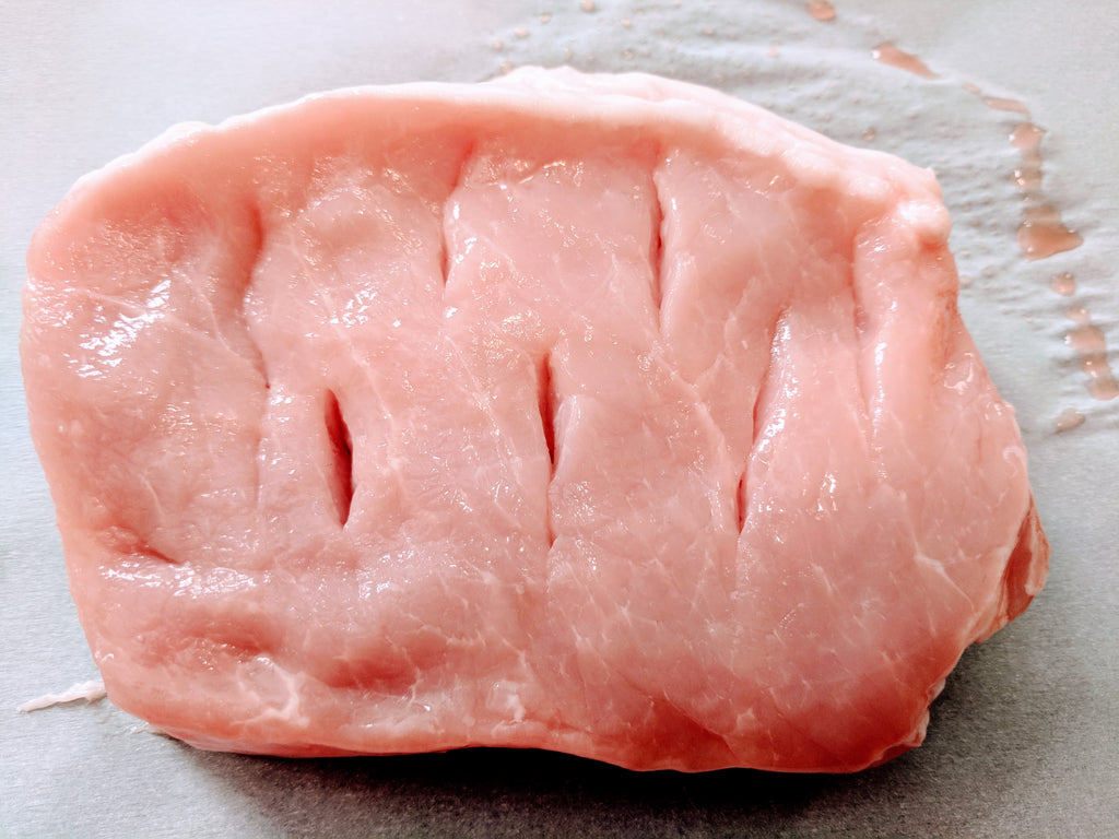 Pork cut with vertical slits