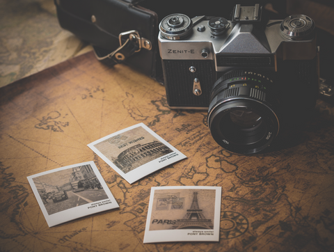 image of map and vintage film analogue camera with film