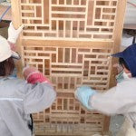 Sanding the lattice shelf on a Carved Coffee Table