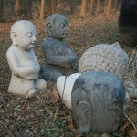 Stone buddhas in the grounds of the Beijing antique workshop