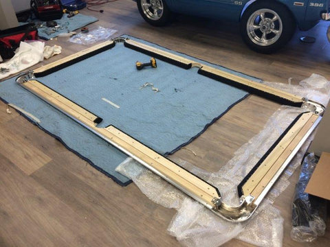 Quality components on display during the setup of a car pool table in our showroom