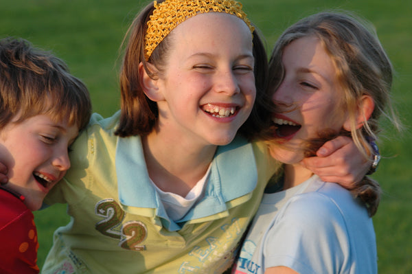 Three girls laughing