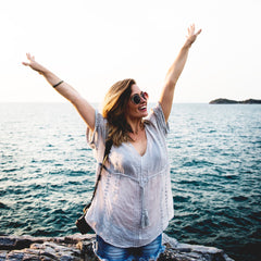 Jubilant traveller at the water front