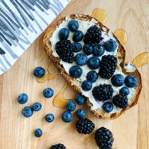 Blueberry and blackberry tartine with ricotta cheese