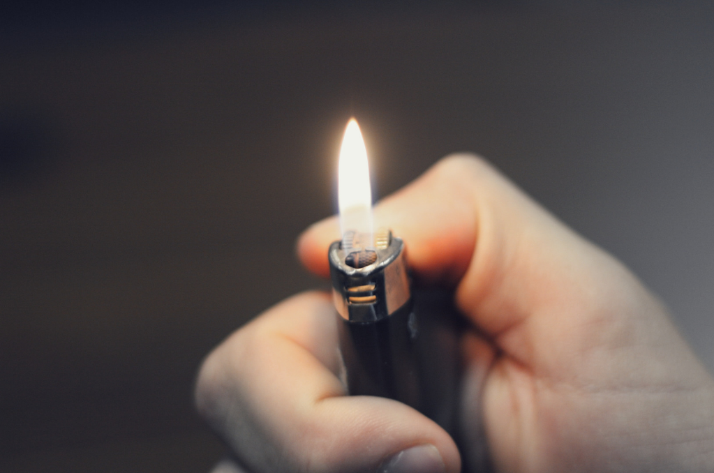 Lighter with flame