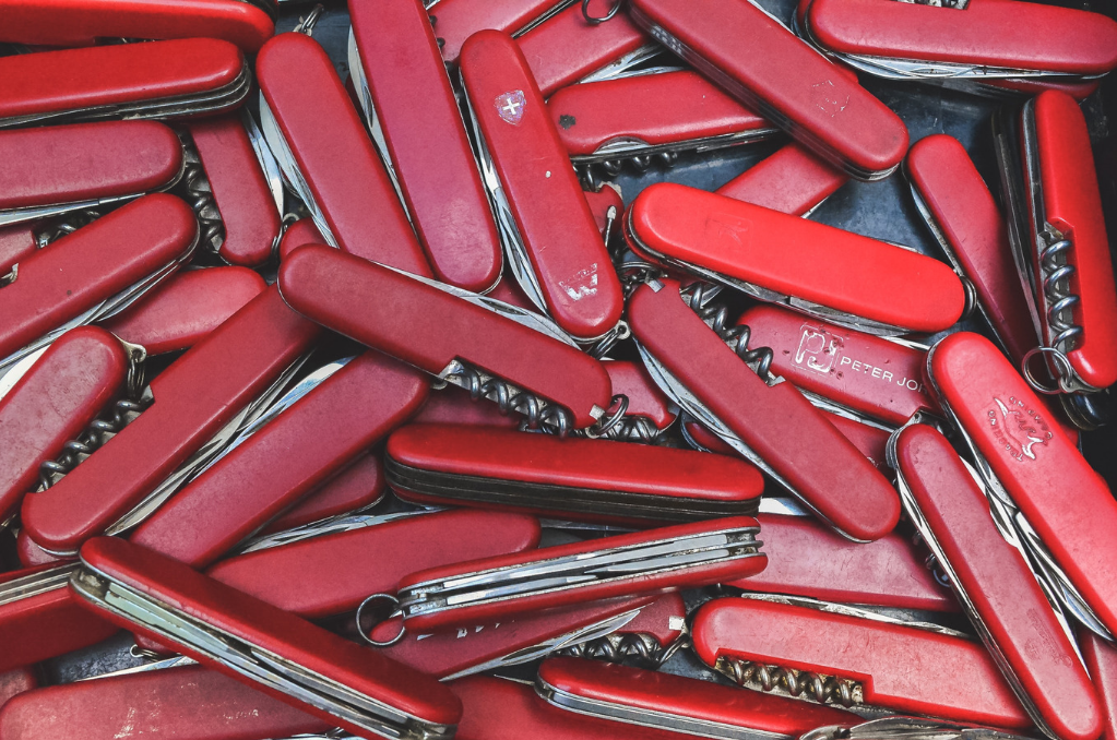 Pile of red multi tools