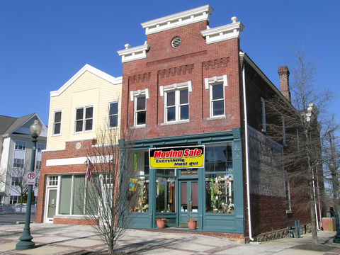 Large Moving Sale Banner on Building