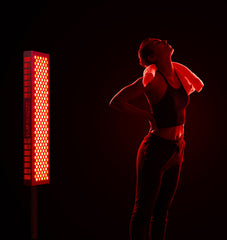 woman using LED Light therapy for back pain