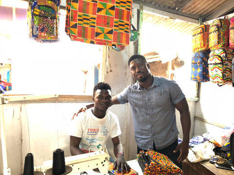 Afrisocks CEO, Huzaif, with Madi, in his new shop