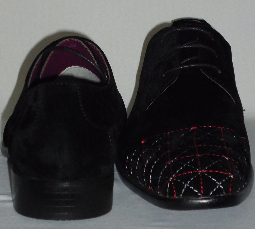 black dress shoes with white stitching