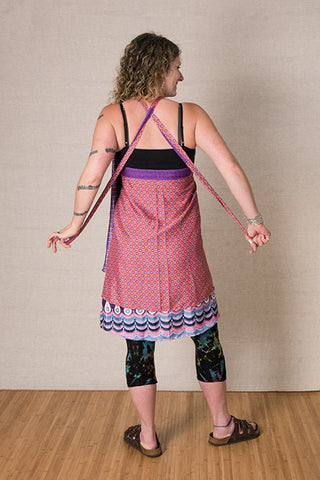Step 3: Cross the straps back over each other behind your neck, and pull the straps straight out and down.