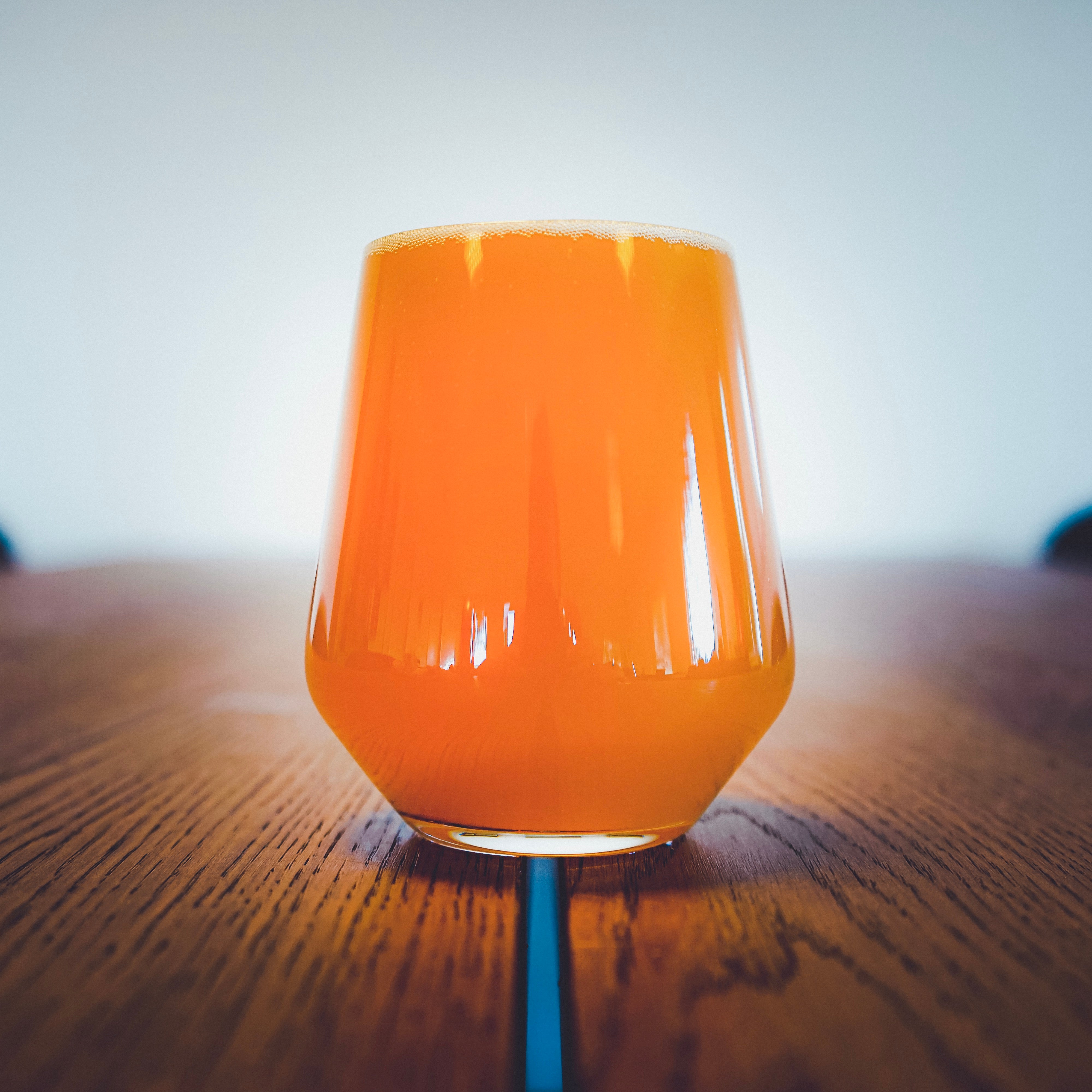 A glass of Family First on the table at the office at the brewery