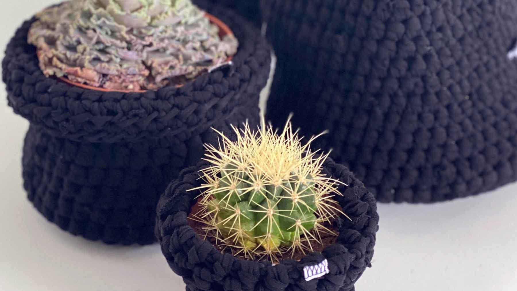 Group of hand crocheted pot plant covers and baskets made from waste fabric