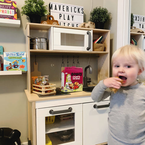 Fun indoor activities for kids. Pretending to be a cook while serving up Bobo's Oat Bars