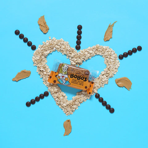 A heart outline of oats with a Bobo's Oat Bar in the center. 