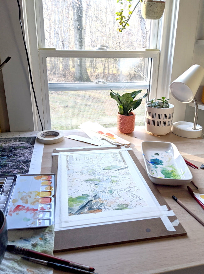 studio desk with art in progress