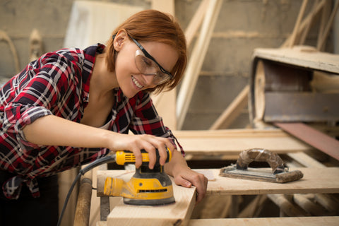 Woman crafting wood