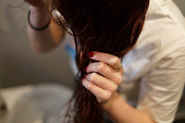 Applying oil to hair