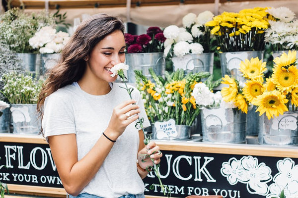 Woman smelling flowers